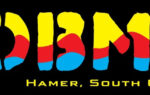 Colorful text graphic with large yellow, red, and blue stylized letters on a black background, with smaller yellow letters below partially visible.