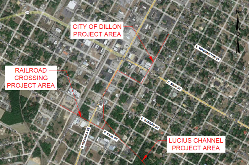 Aerial map showing labeled project areas: City of Dillon, Railroad Crossing, and Lucius Channel, highlighted with red outlines in an urban grid.