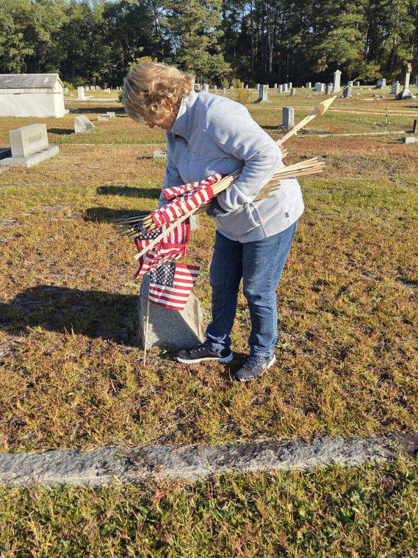 Placing flags on Veterans' grave sites at Riverside Cemetery in Dillon. (Photos by Johnnie Daniels/The Dillon County News, LLC)
