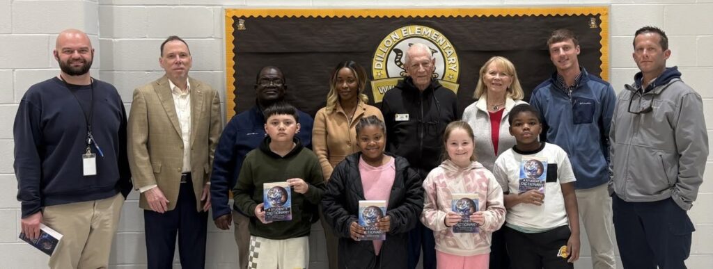 Kids and Rotary members with dictionaries