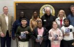 Kids and Rotary members with dictionaries