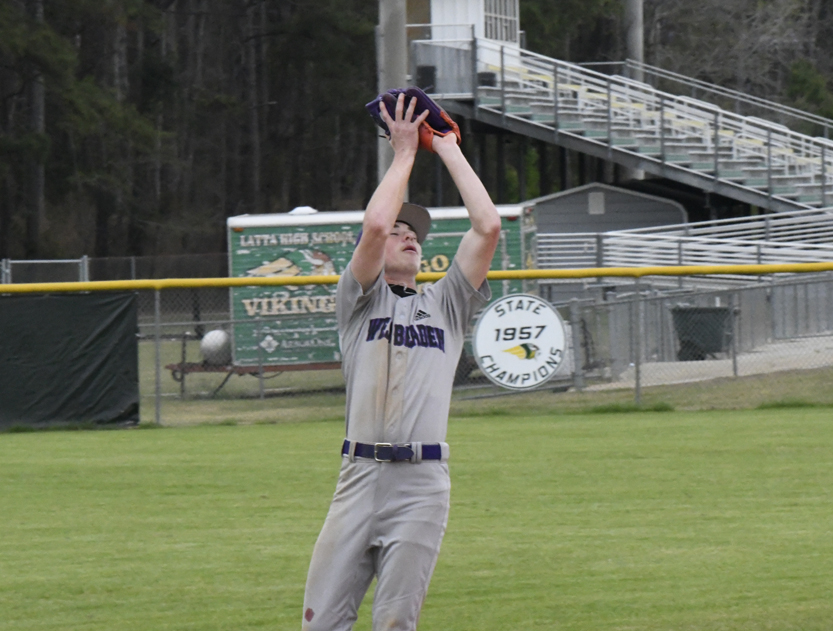 West Bladen's shortstop catches a fly ball