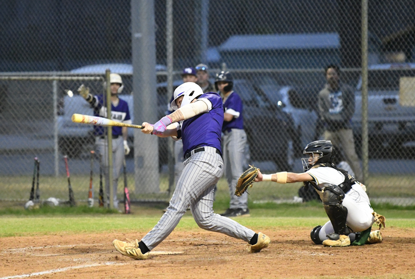 Weston Hilburn hits a grounder by second