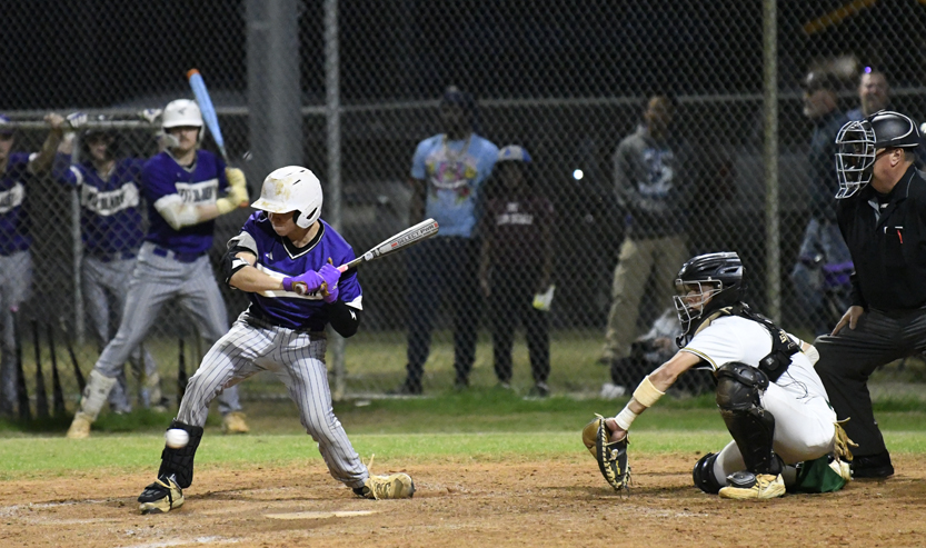 Tyler Lewis watches a low one