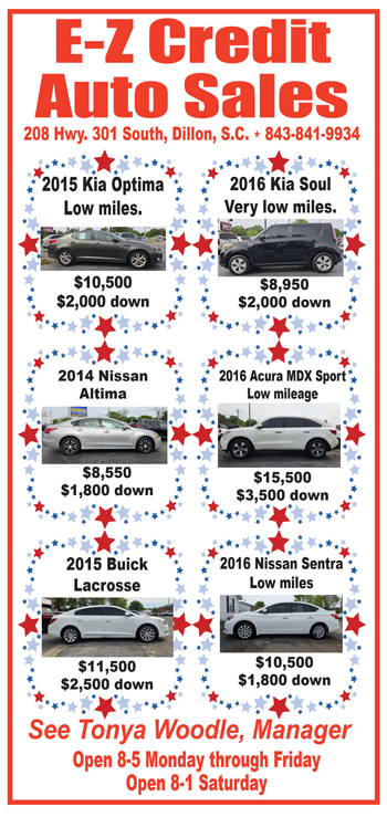 Car dealership advertisement featuring six used cars, their prices, down payment amounts, and star decorations on a red, white, and blue border.