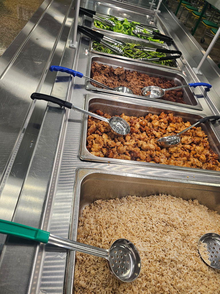 A food serving station that shows various items including asparagus