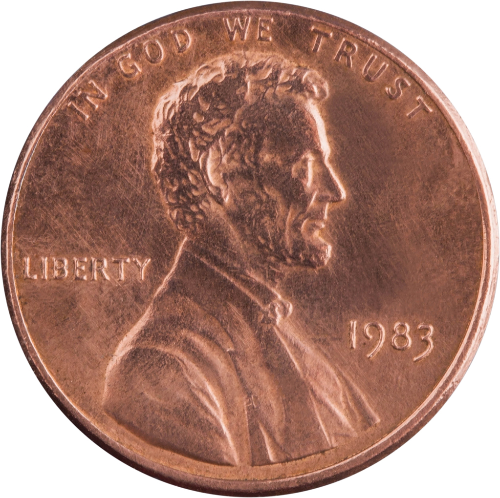 Close-up of a 1983 United States penny featuring Abraham Lincoln's profile, with the words "IN GOD WE TRUST," "LIBERTY," and the year "1983."