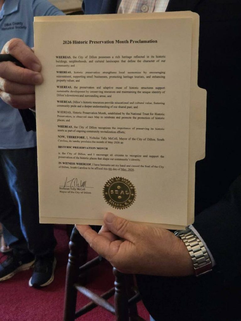 A person holding an official document titled “2026 Historic Preservation Month Proclamation” with a gold seal and signature at the bottom.