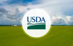 USDA logo overlaid on a green field with a cloudy blue sky in the background.