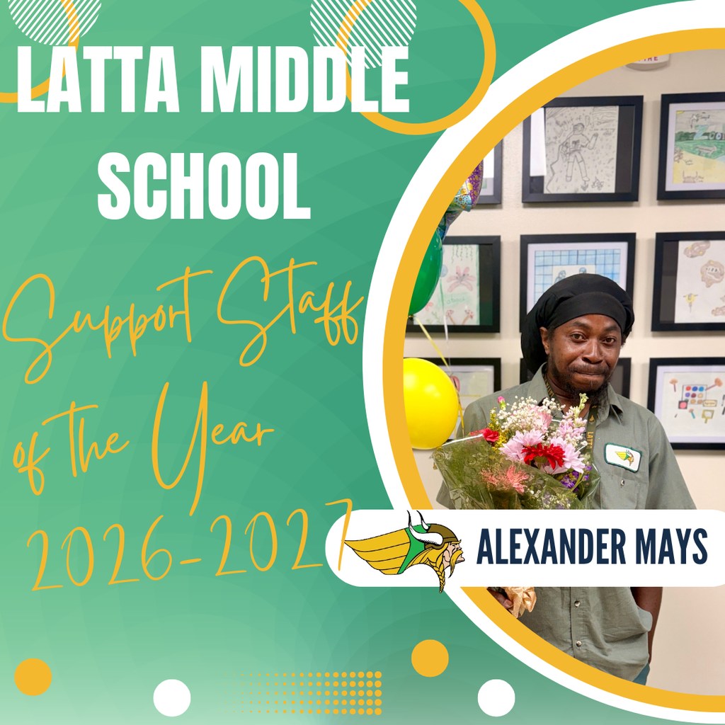 Latta Middle School Support Staff of the Year 2026-2027, Alexander Mays, holding flowers, standing in front of framed student artwork.