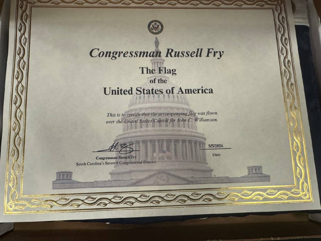 Certificate from Congressman Russell Fry certifying a U.S. flag was flown over the Capitol for John C. Williamson, dated 5/5/2026, with a gold decorative border.