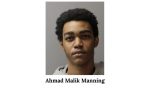 A young man with short curly hair, wearing a light-colored hoodie, photographed against a gray background, with the name "Ahmad Malik Manning" written below.