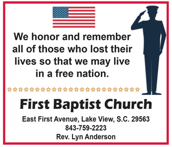 Saluting soldier silhouette, American flag, and memorial message from First Baptist Church honoring those who lost their lives for freedom. Contact info and pastor's name included.