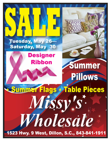 Colorful sale flyer for Missy's Wholesale featuring summer pillows, designer ribbon, summer flags, and table pieces. Sale dates: Tuesday, May 26 to Saturday, May 30.