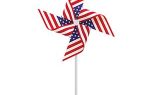 A pinwheel decorated with the American flag pattern, featuring red and white stripes and blue with white stars, mounted on a white stick.