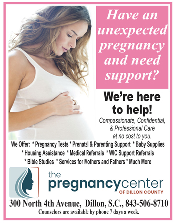 Pregnant woman gently touching her belly; text offers support and services for unexpected pregnancies from The Pregnancy Center of Dillon County, with contact details and office availability.