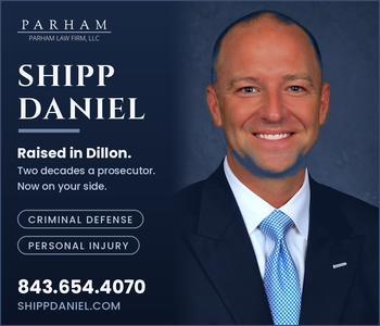 Smiling man in a suit with text promoting Shipp Daniel for criminal defense and personal injury law, including contact information and website for Parham Law Firm.