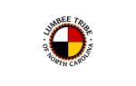 Seal of the Lumbee Tribe of North Carolina, featuring a medicine wheel with black, red, white, and yellow sections, surrounded by patterned border and tribal name.