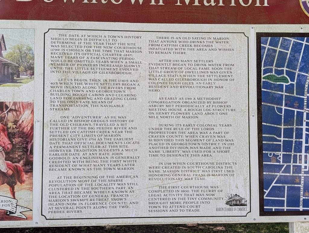 Historical marker describing the early history and settlement of Marion, South Carolina, with information about pioneers, river travel, and the origin of the town’s name.