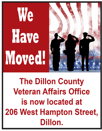 Sign announcing the Dillon County Veteran Affairs Office has moved to 206 West Hampton Street, Dillon, with silhouettes of saluting soldiers and an American flag background.